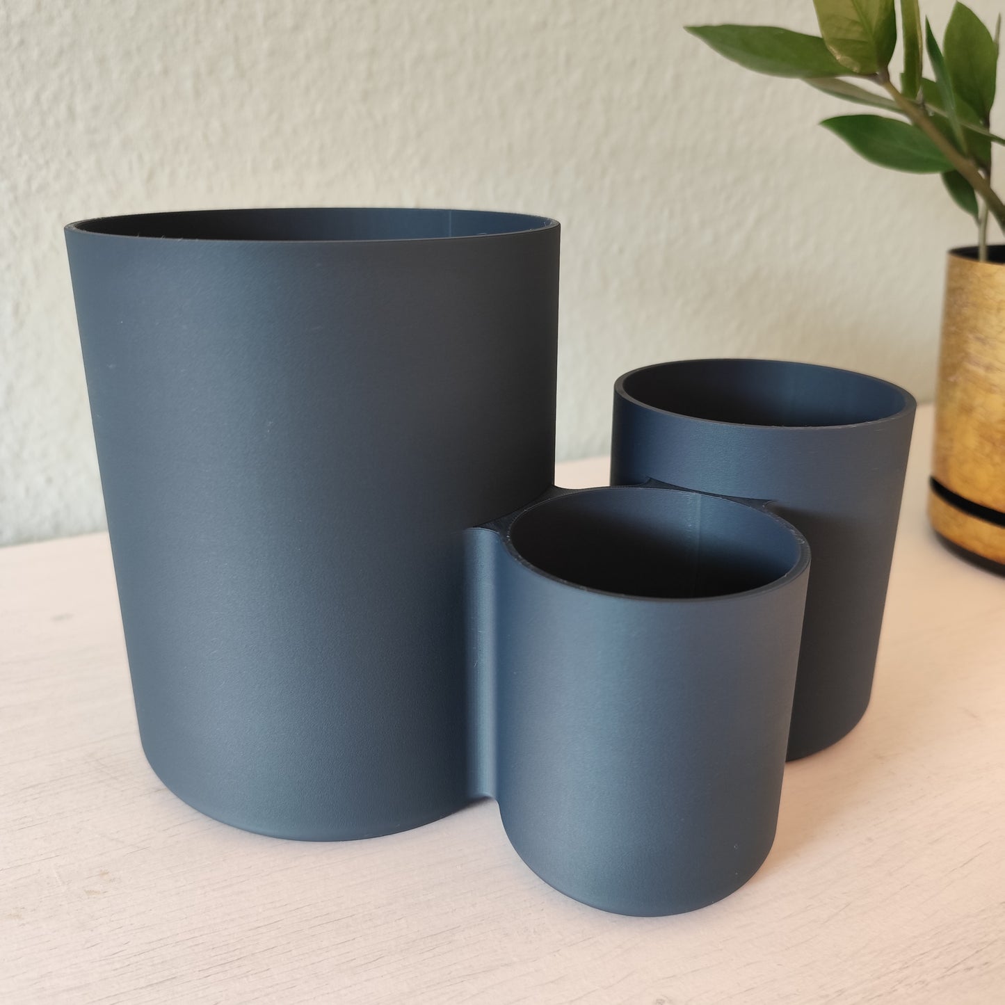 Kitchen utensil holder styled on countertop next to stove with wooden spoons