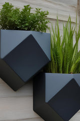 Close-up of low poly wall planter showing geometric faceted surface