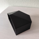 Detail of textured facets and subtle shadows on modern wall planter