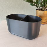 Modern utensil holder on kitchen counter with cooking tools, neutral styling