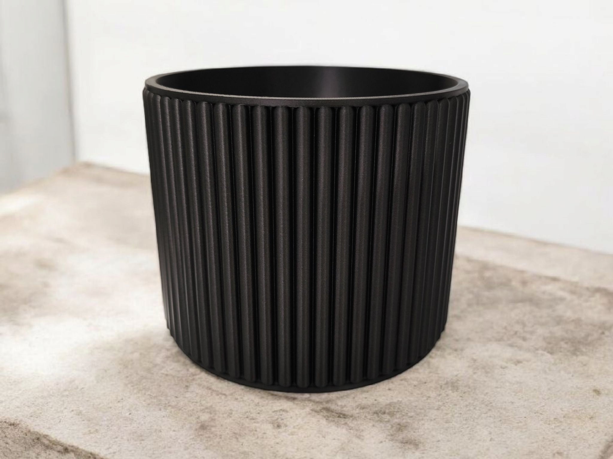 Textured surface of ribbed cup catching soft light