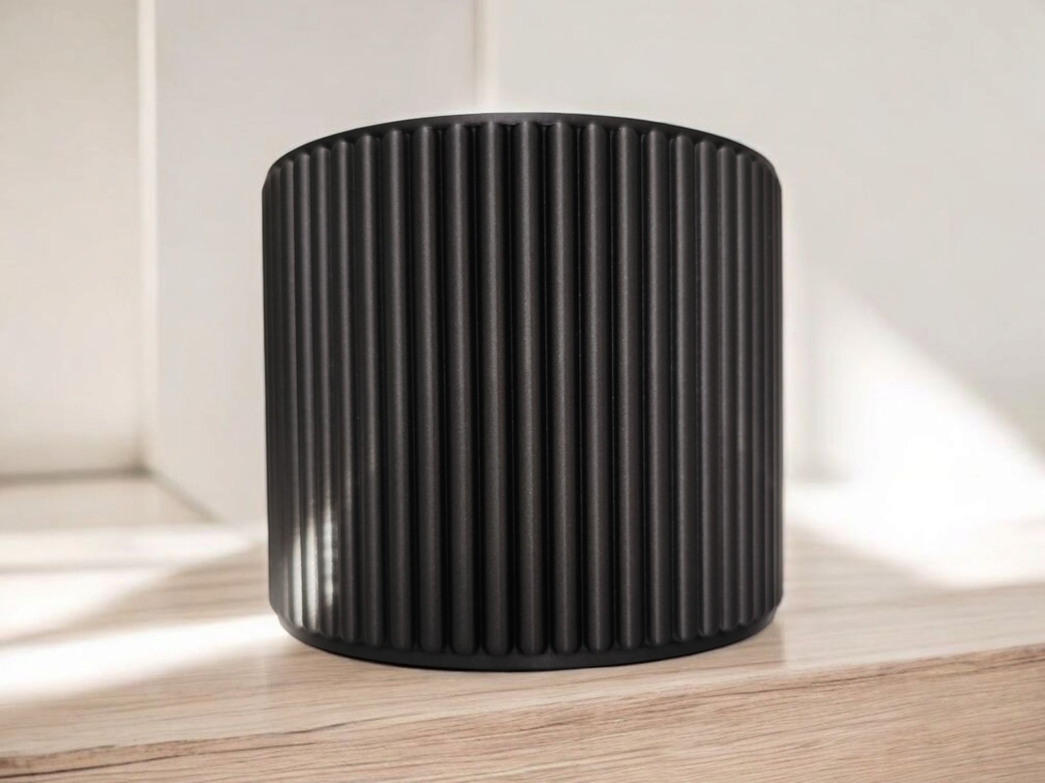 Close-up of ribbed bathroom organizer cup showing vertical texture detail