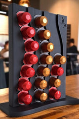 Wavy nespresso capsule holder filled with assorted coffee capsules, close-up view of textured surface
