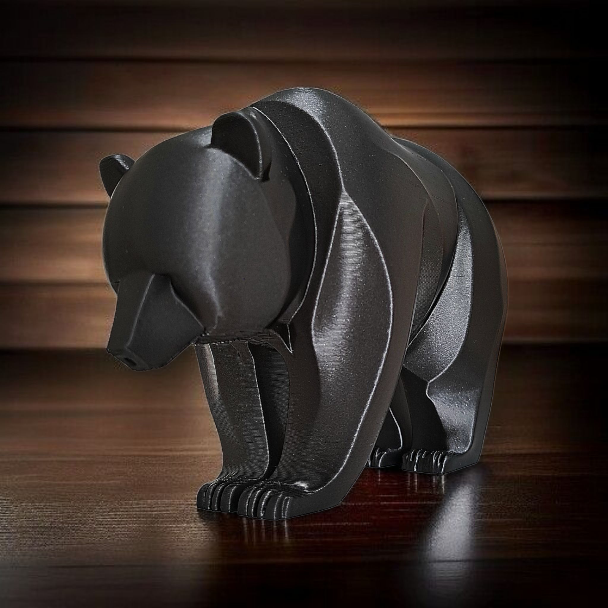 Close-up of minimalist bear sculpture showing curved lines and smooth surface