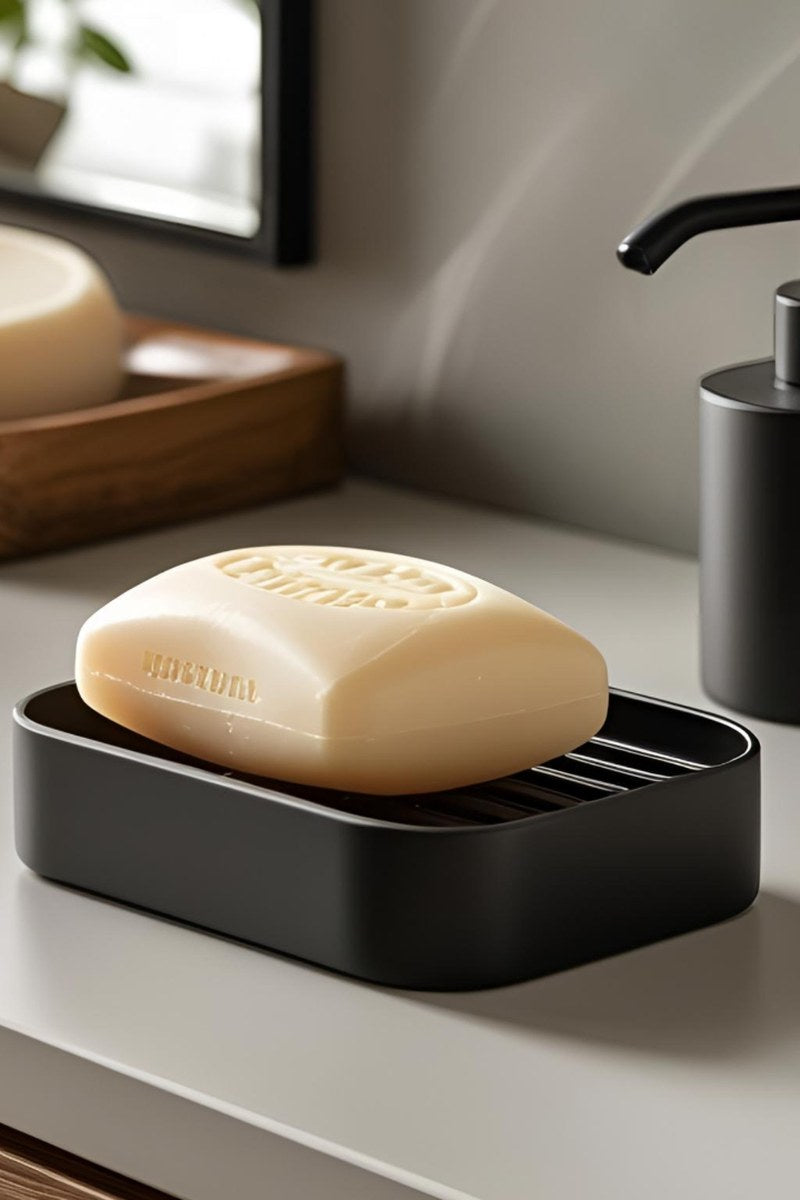 White soap holder with ribbed drainage pattern, close-up view