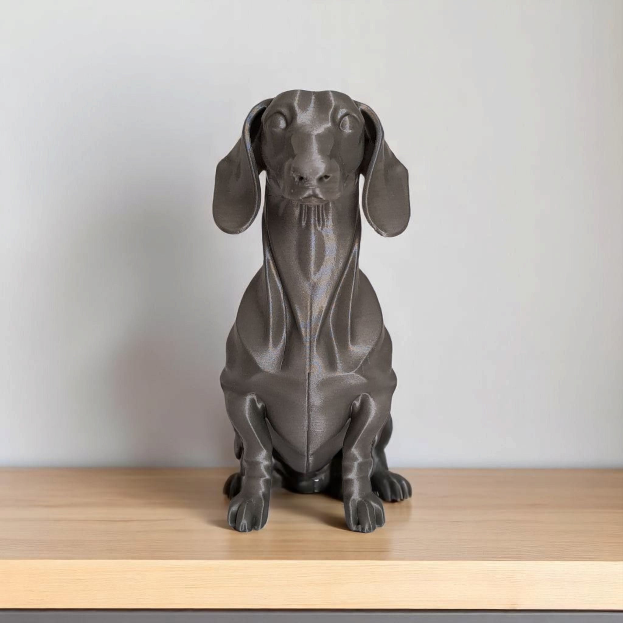 Minimalist dachshund sculpture with clean geometric form, side view