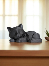 Detail of textured geometric forms on sleeping kitten sculpture