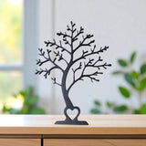 Side detail of minimalist tree decor showing the graceful curved profile