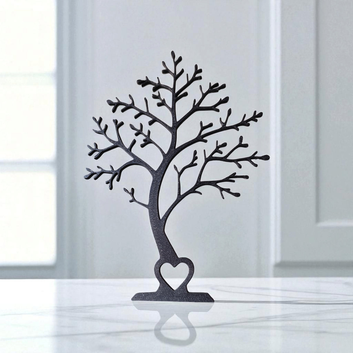 Minimalist tree decor silhouette viewed from the front, showing clean branch lines