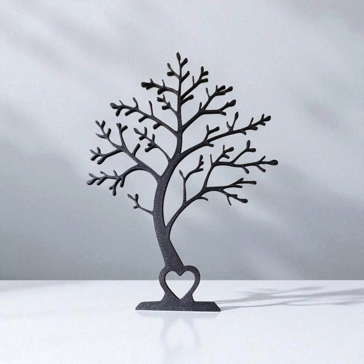 Minimalist tree decor silhouette viewed from the front, showing clean branch lines