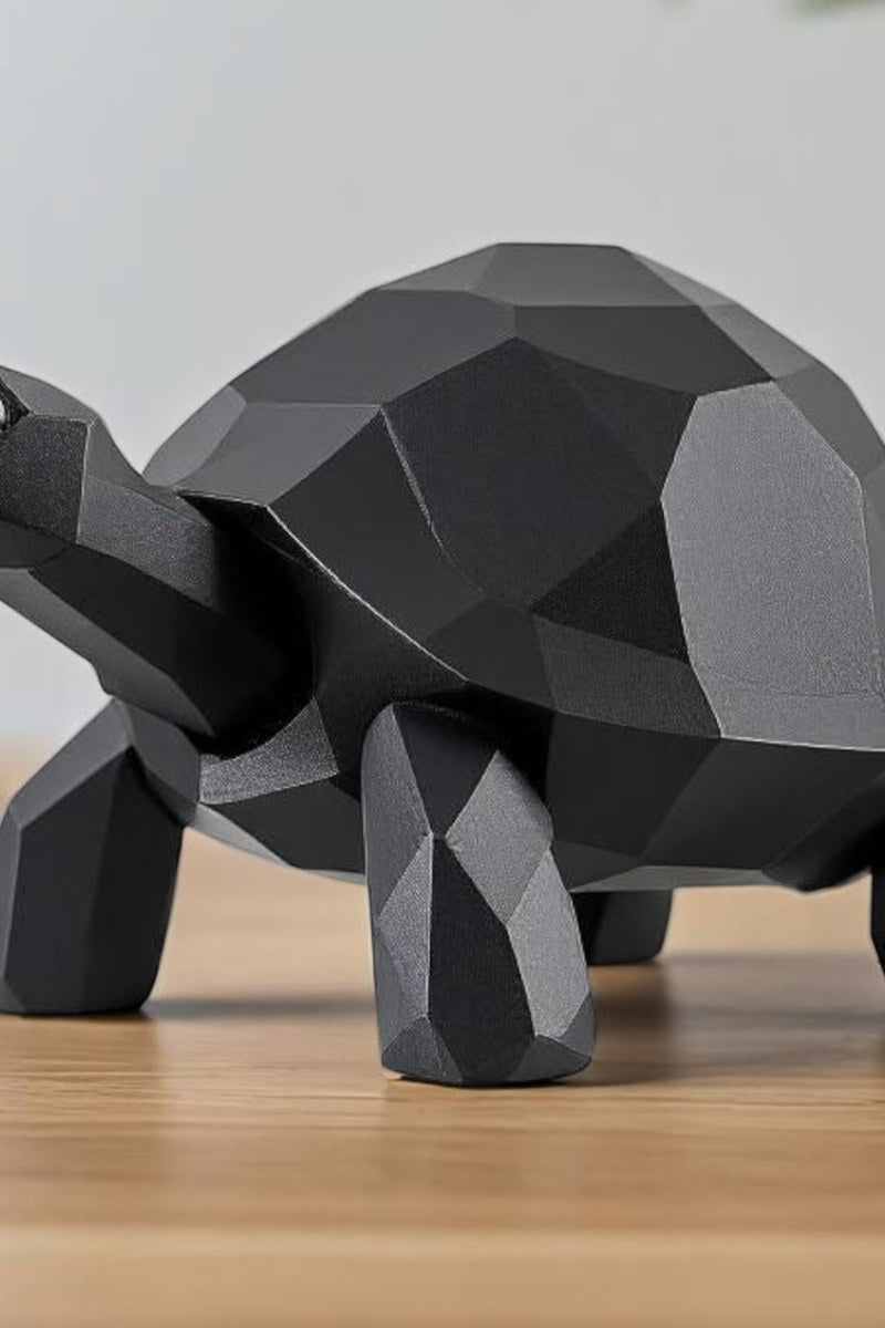 Close-up of low poly turtle sculpture showing geometric faceted surface and clean lines