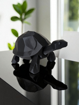 Detail view of turtle's angular form emphasizing the geometric low poly design