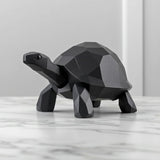 Close-up of low poly turtle sculpture showing geometric faceted surface and clean lines