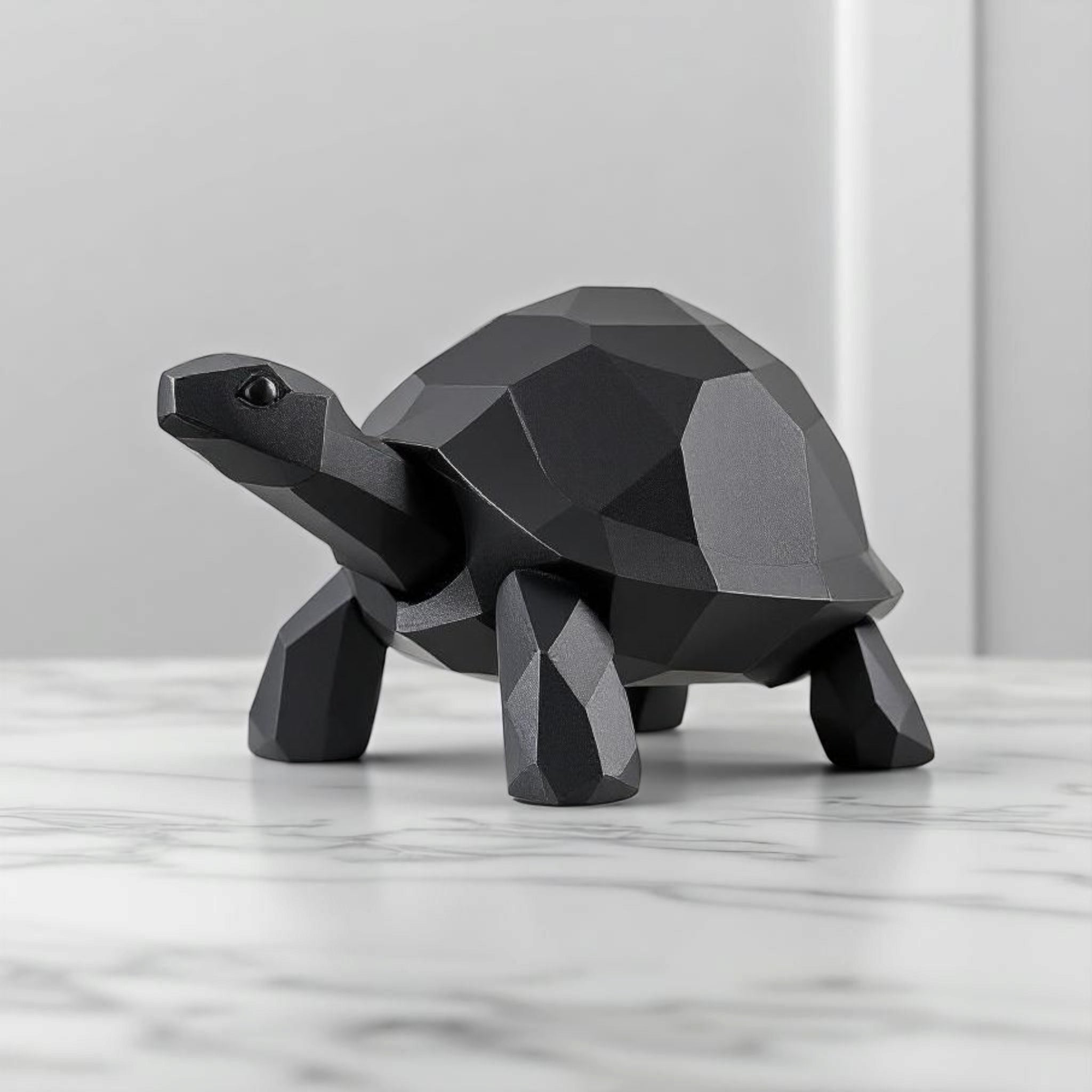 Close-up of low poly turtle sculpture showing geometric faceted surface and clean lines