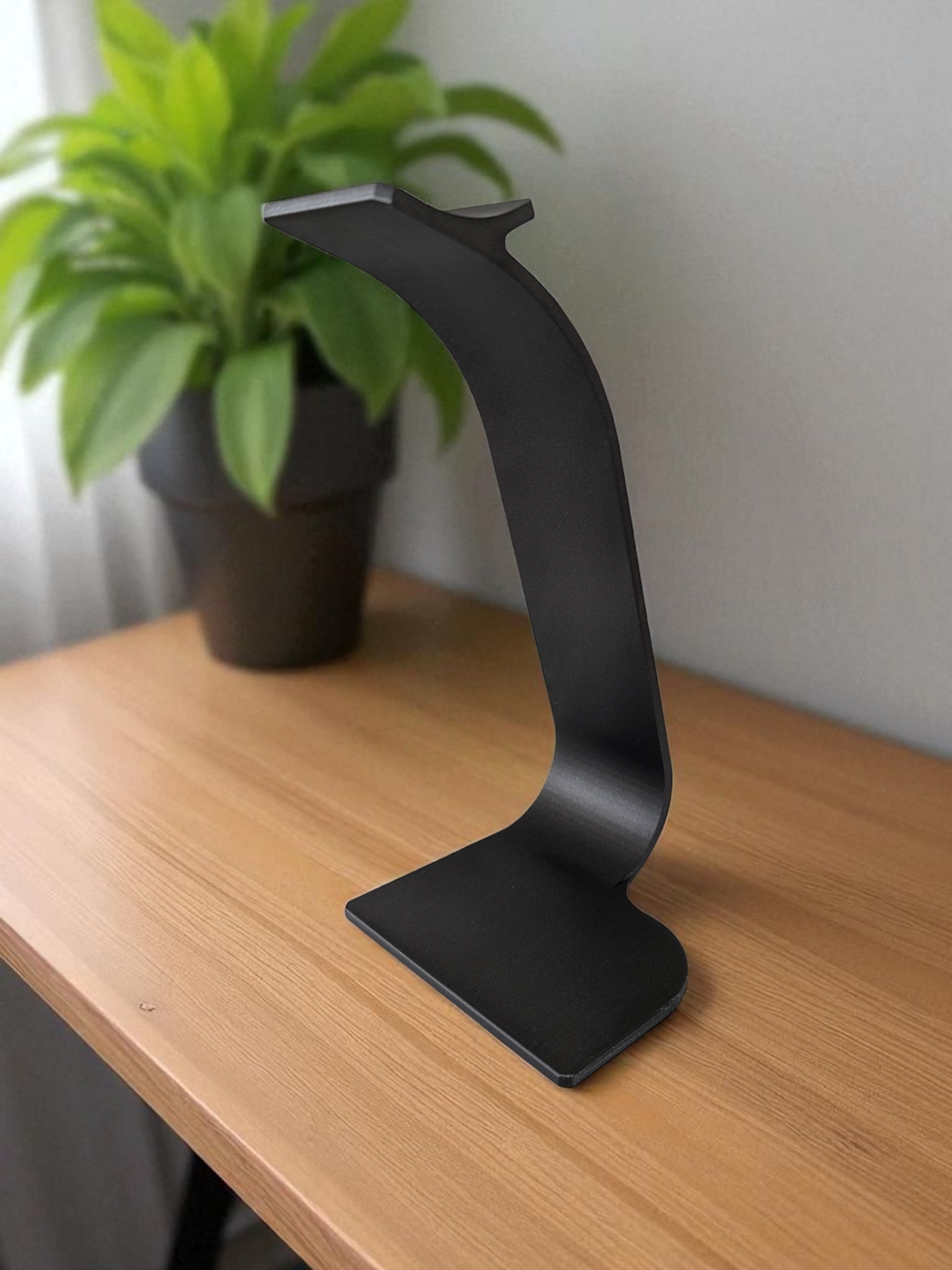 Detail of the smooth arc on the Swing headphone stand, highlighting clean design lines