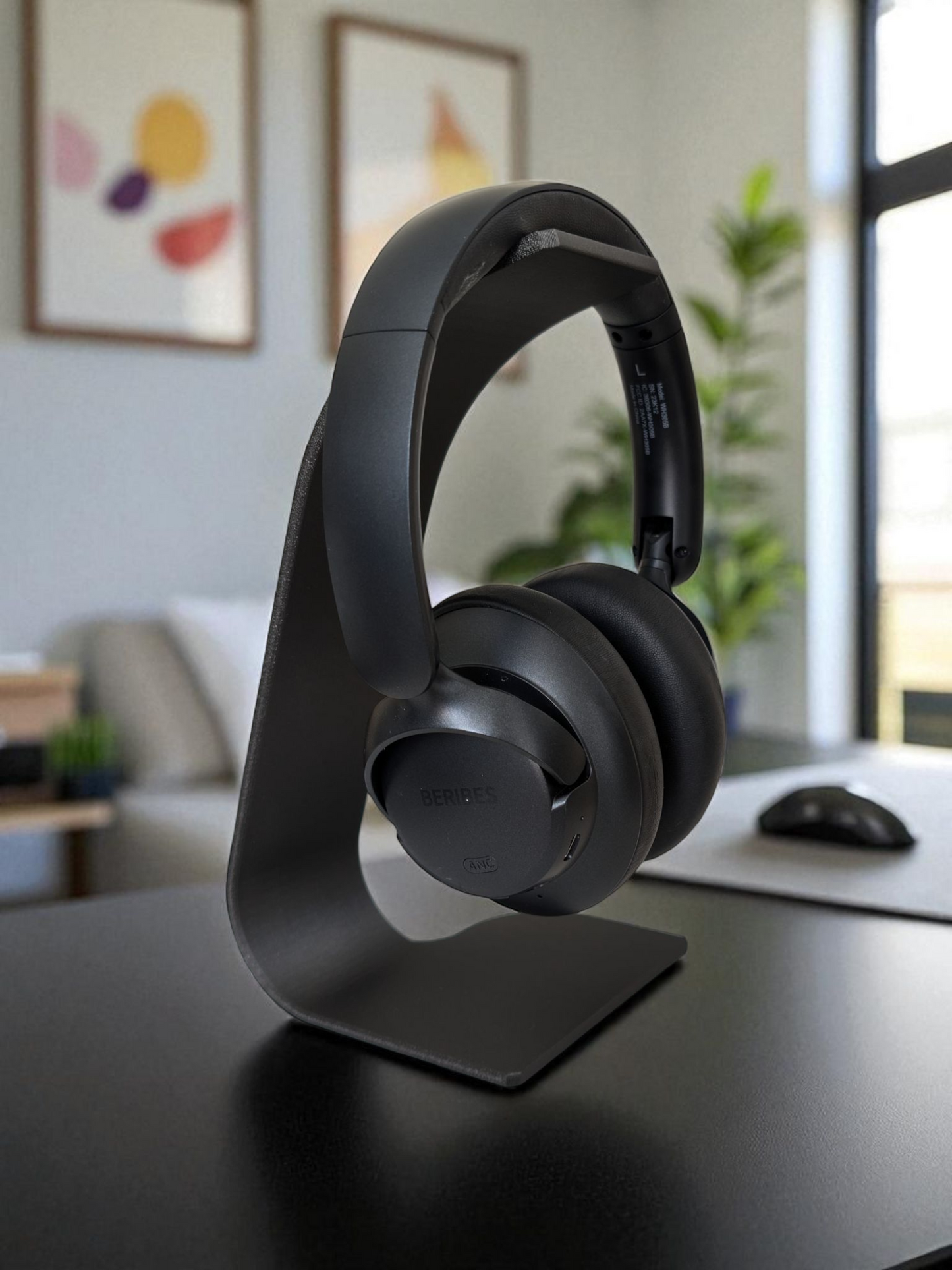 Swing headphone stand viewed from the side, showing curved cantilever arm and stable base
