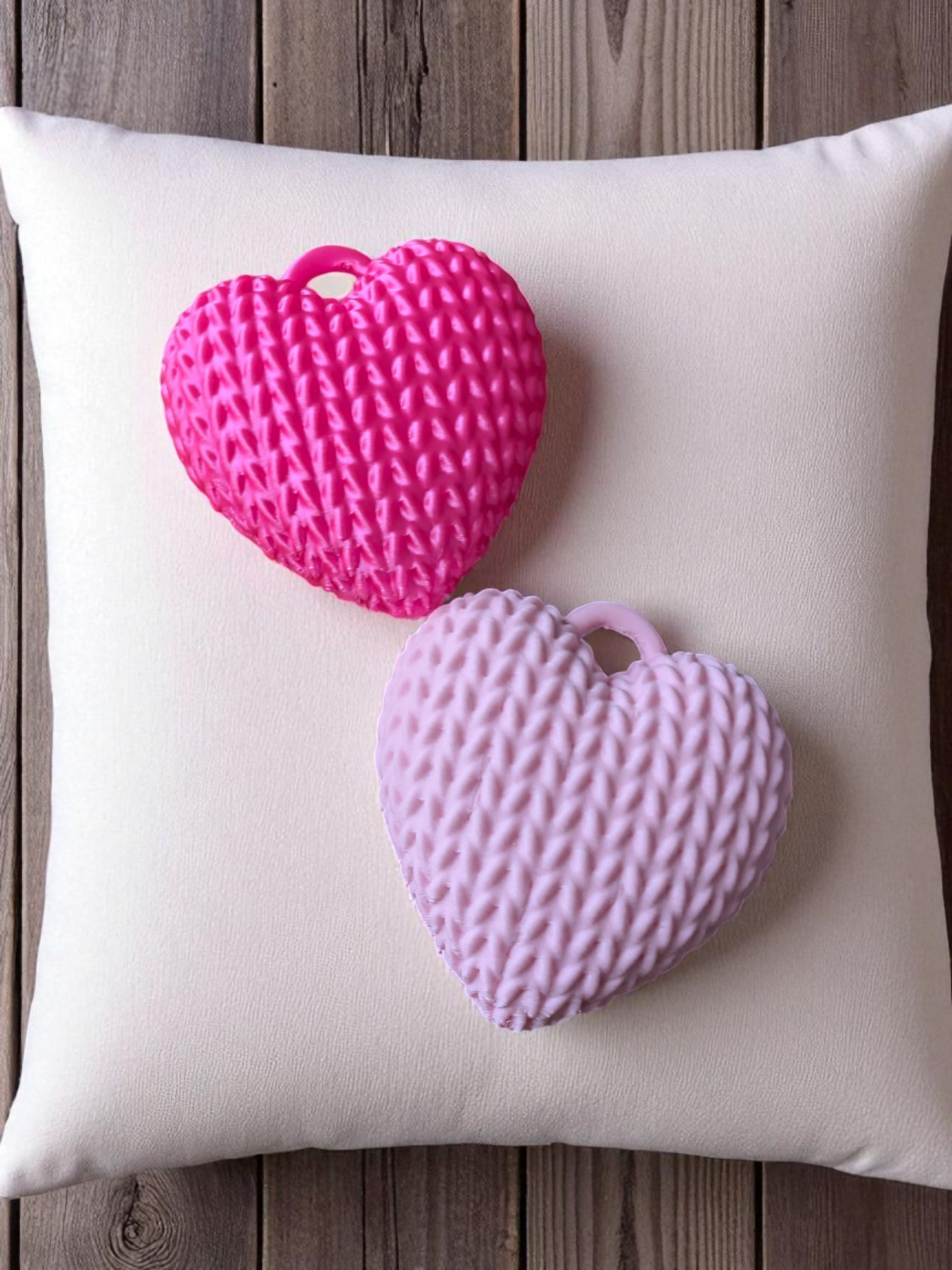Texture detail of knitted heart keychain with woven pattern