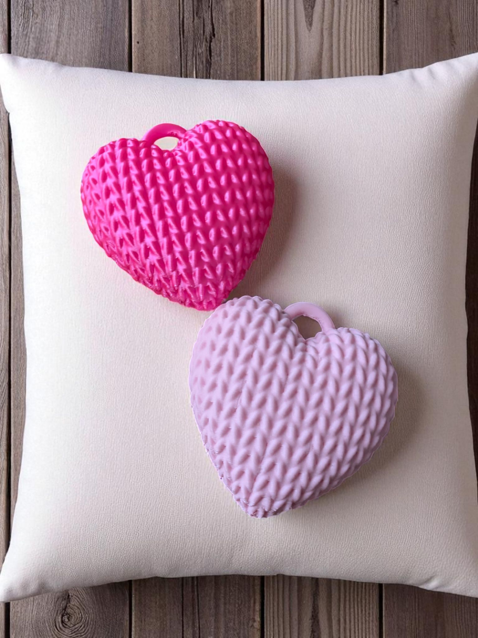 Texture detail of knitted heart keychain with woven pattern