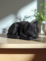 Low poly kitten figurine displayed on wooden desk with minimal styling