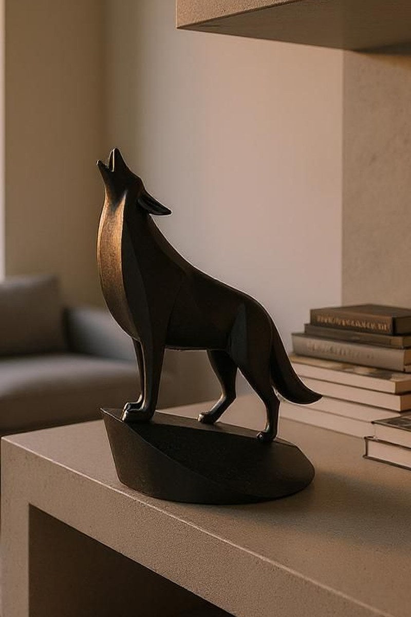 Close-up of minimalist wolf sculpture showing geometric planes and open mouth detail