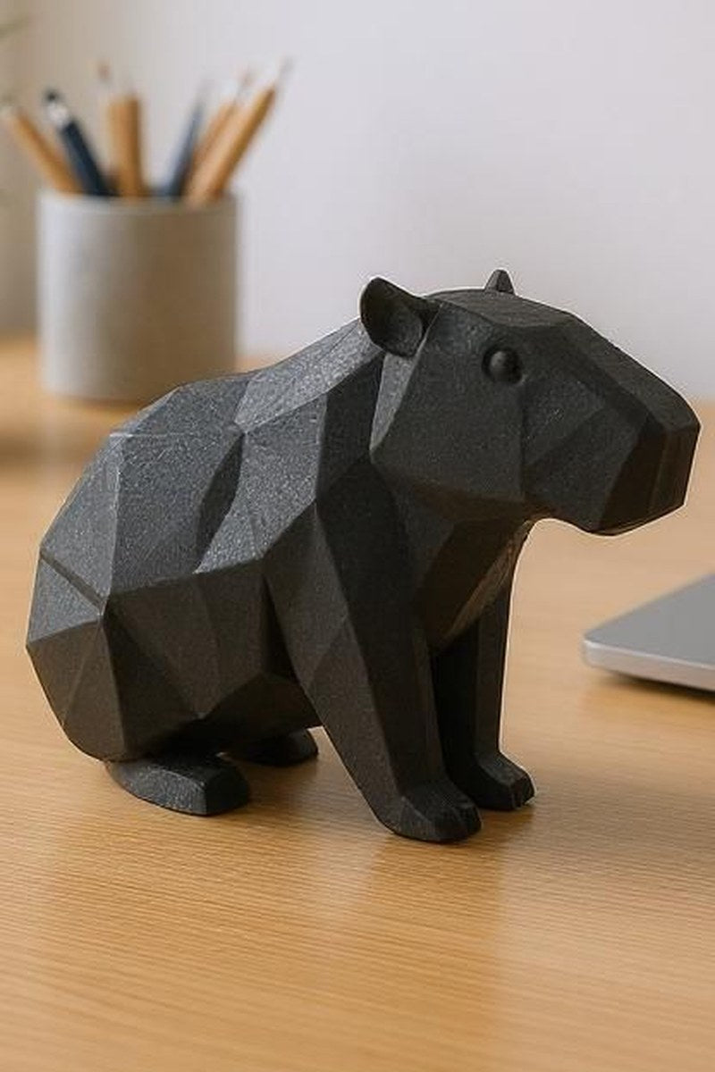 Low poly capybara sculpture showing geometric faceted surface and calm posture