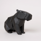 Close-up of the low poly capybara's textured surface with light-catching facets