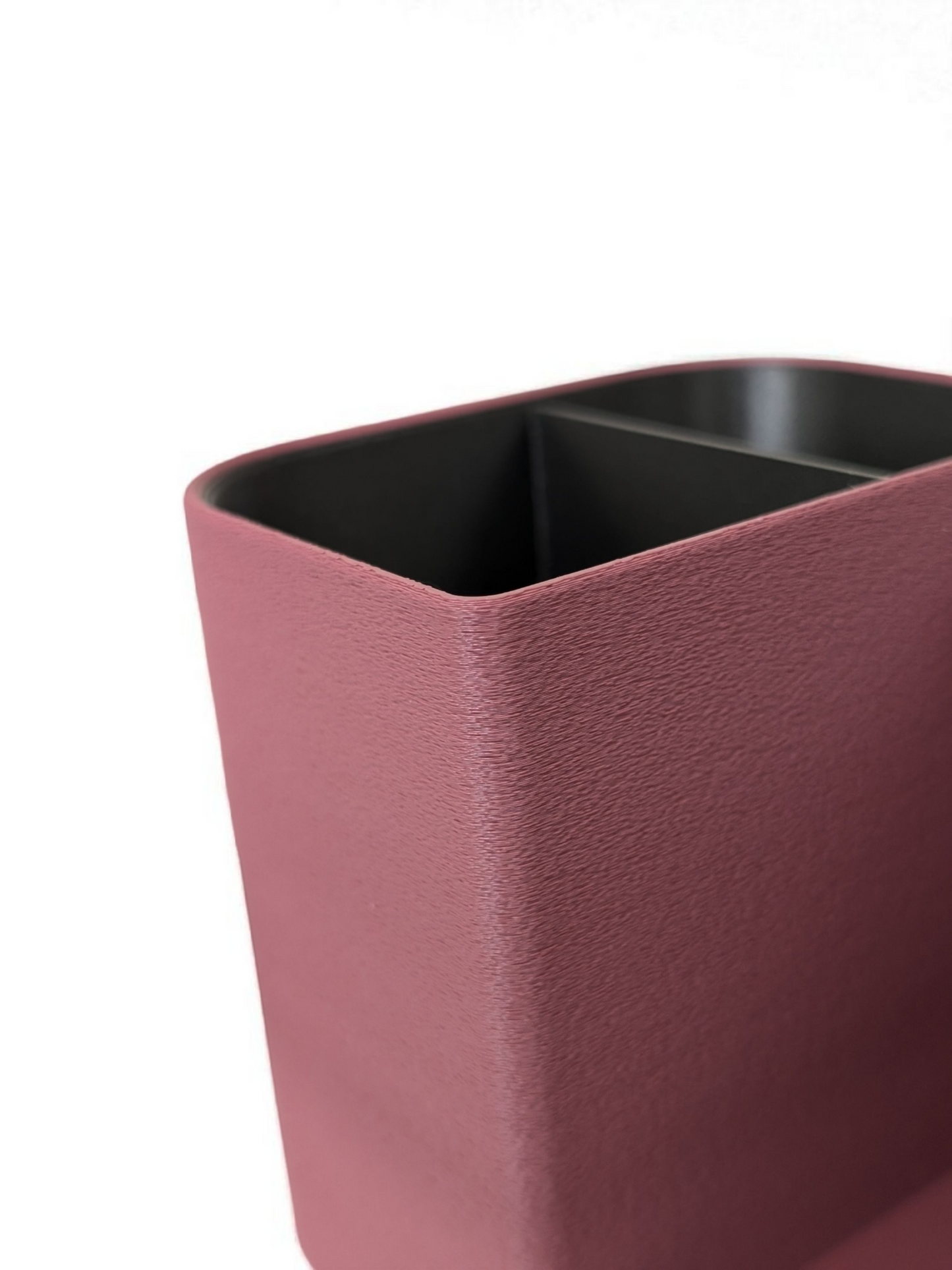 Detail view of desk organizer's textured interior walls and compartments