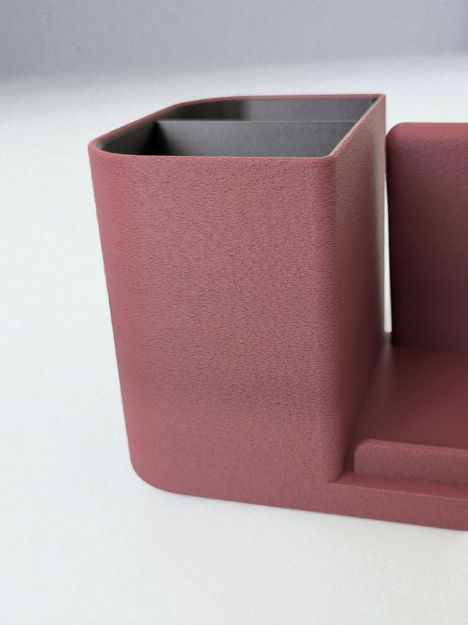 Desk organizer with phone holder showing dual-color design and textured surface