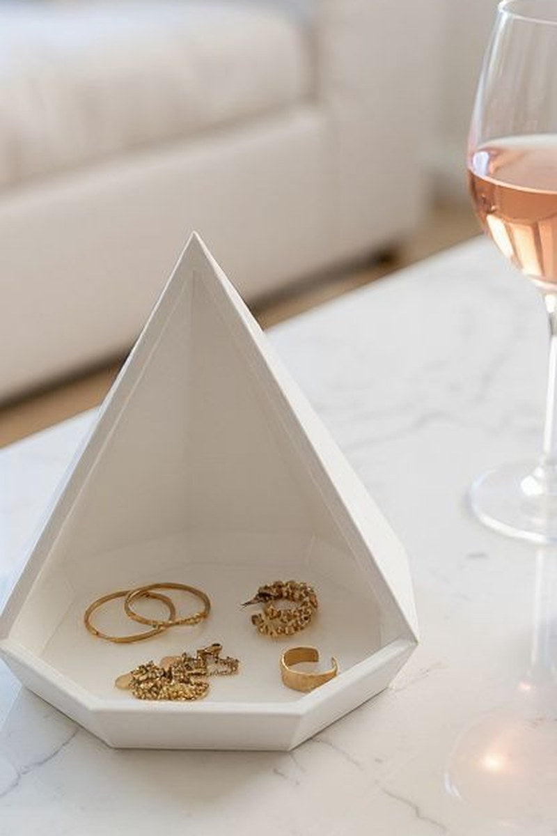 Close-up of geometric pyramid catchall tray showing faceted angles and octagonal base