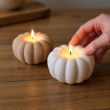 Pumpkin tealight holder in cream, close-up showing smooth surface