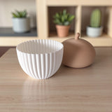 Close-up of ribbed acorn container showing texture detail and LED slot