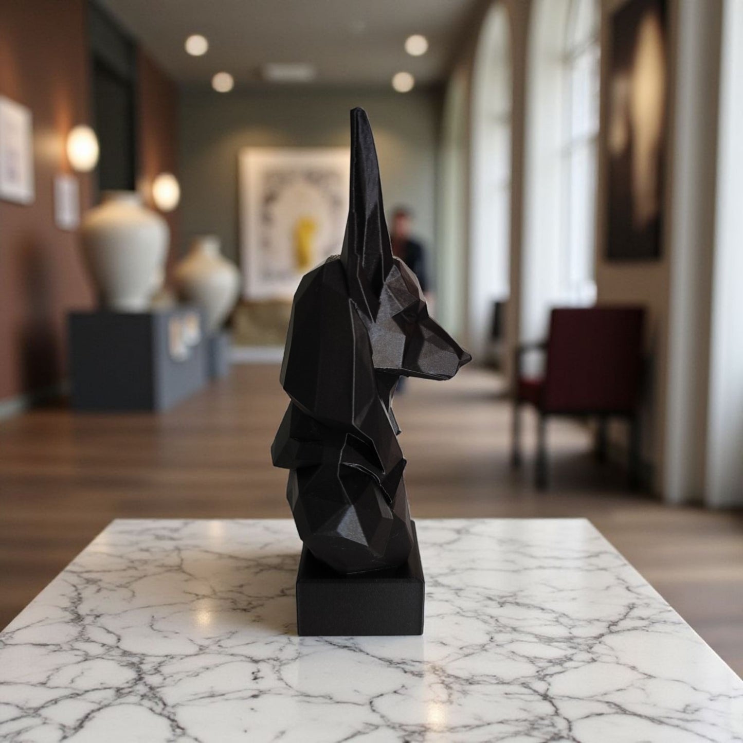 Close-up of low poly anubis bust showing faceted geometric surfaces