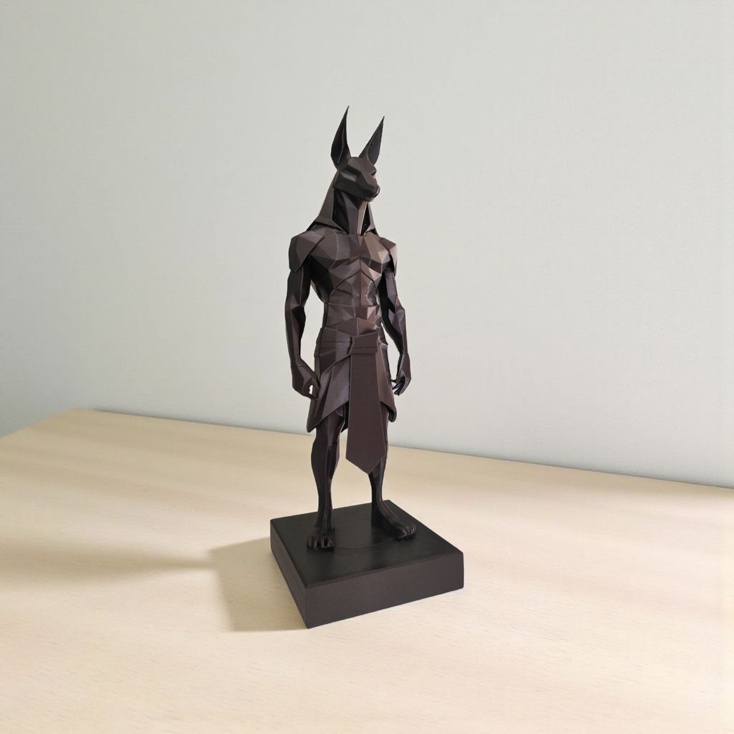 Close-up of low poly anubis statue showing geometric faceted surfaces and angular design