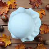 White halloween ghost decoration with LED tealight inside, glowing softly