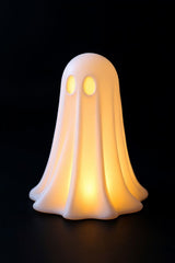 White halloween ghost decoration with LED tealight inside, glowing softly
