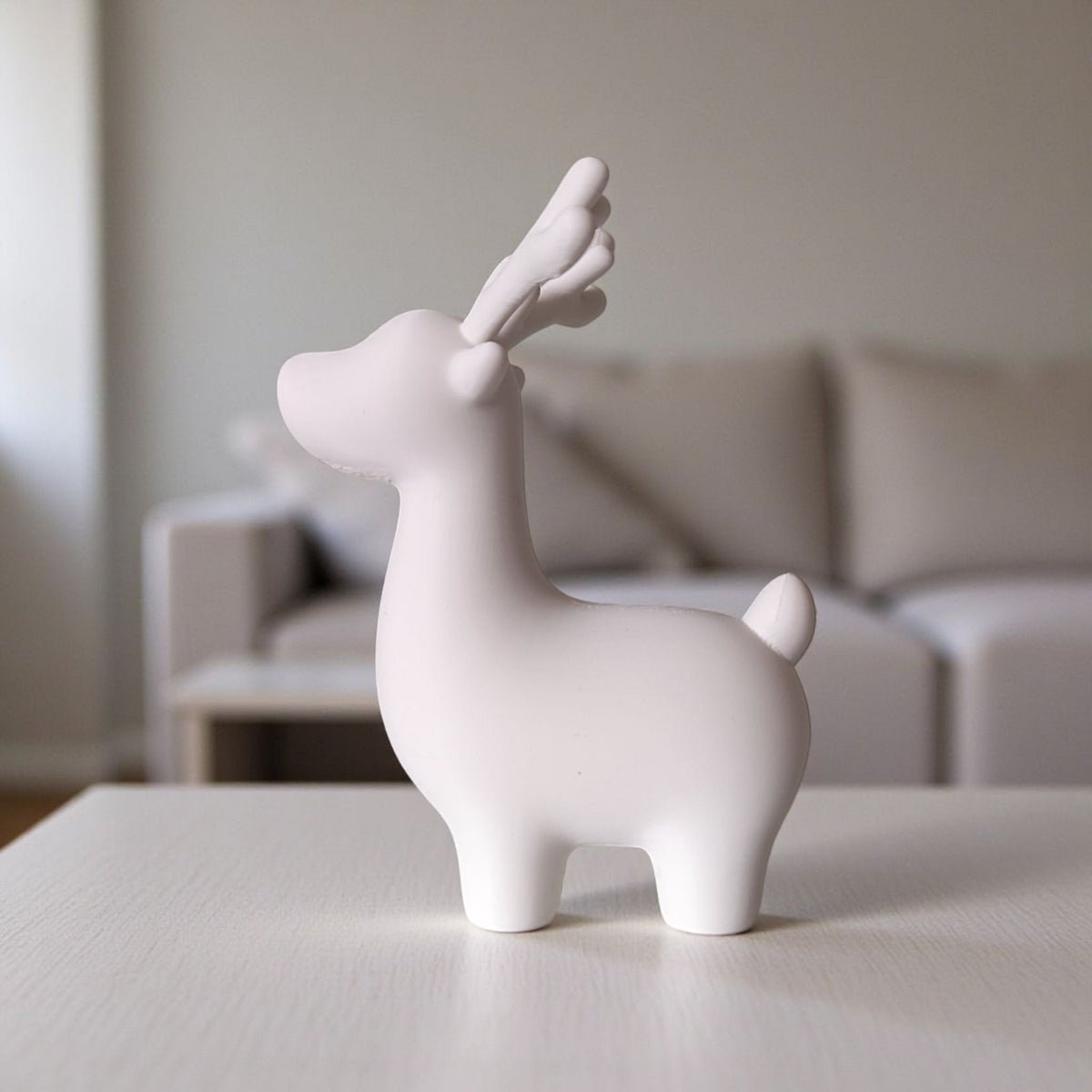 Close-up of minimalist Christmas reindeer decoration showing clean lines