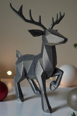 Close-up of minimalist low poly reindeer showing geometric faceted surface and antlers