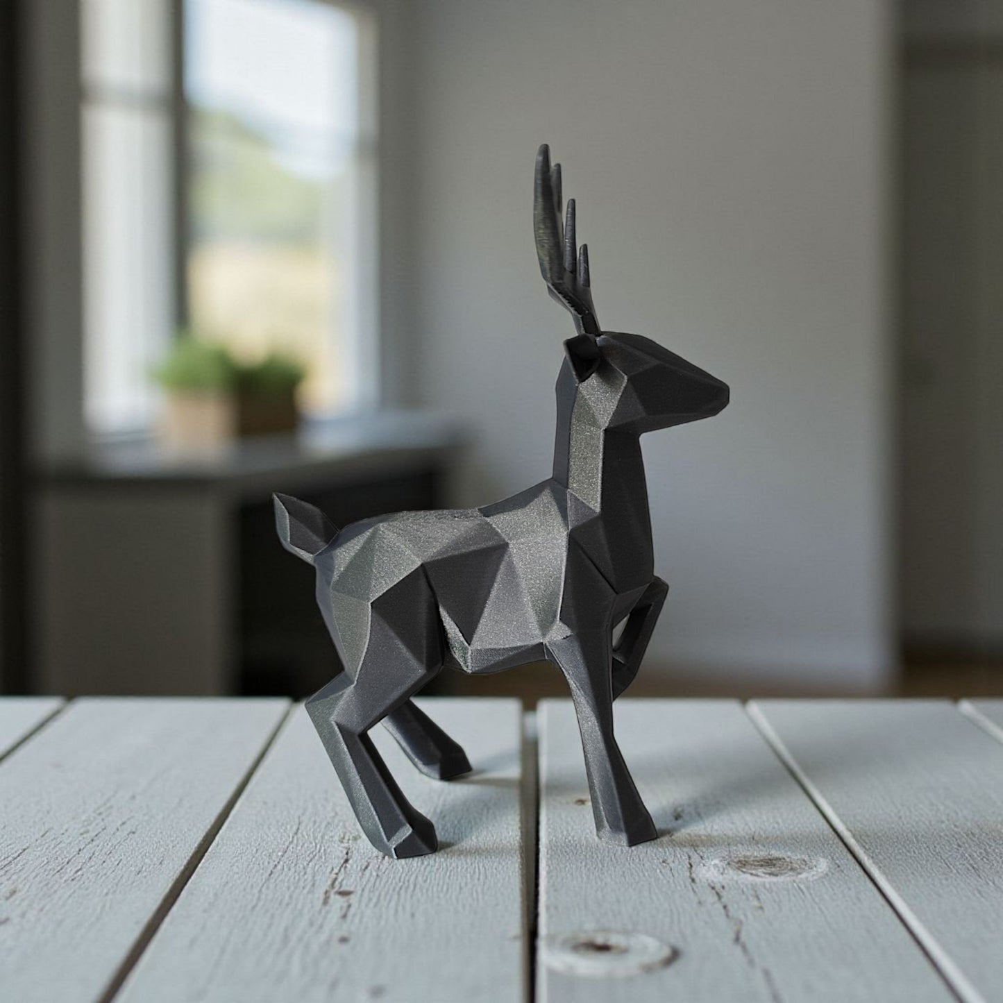 Minimalist low poly reindeer displayed on white shelf in bright interior