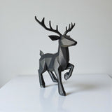 Close-up of minimalist low poly reindeer showing geometric faceted surface and antlers