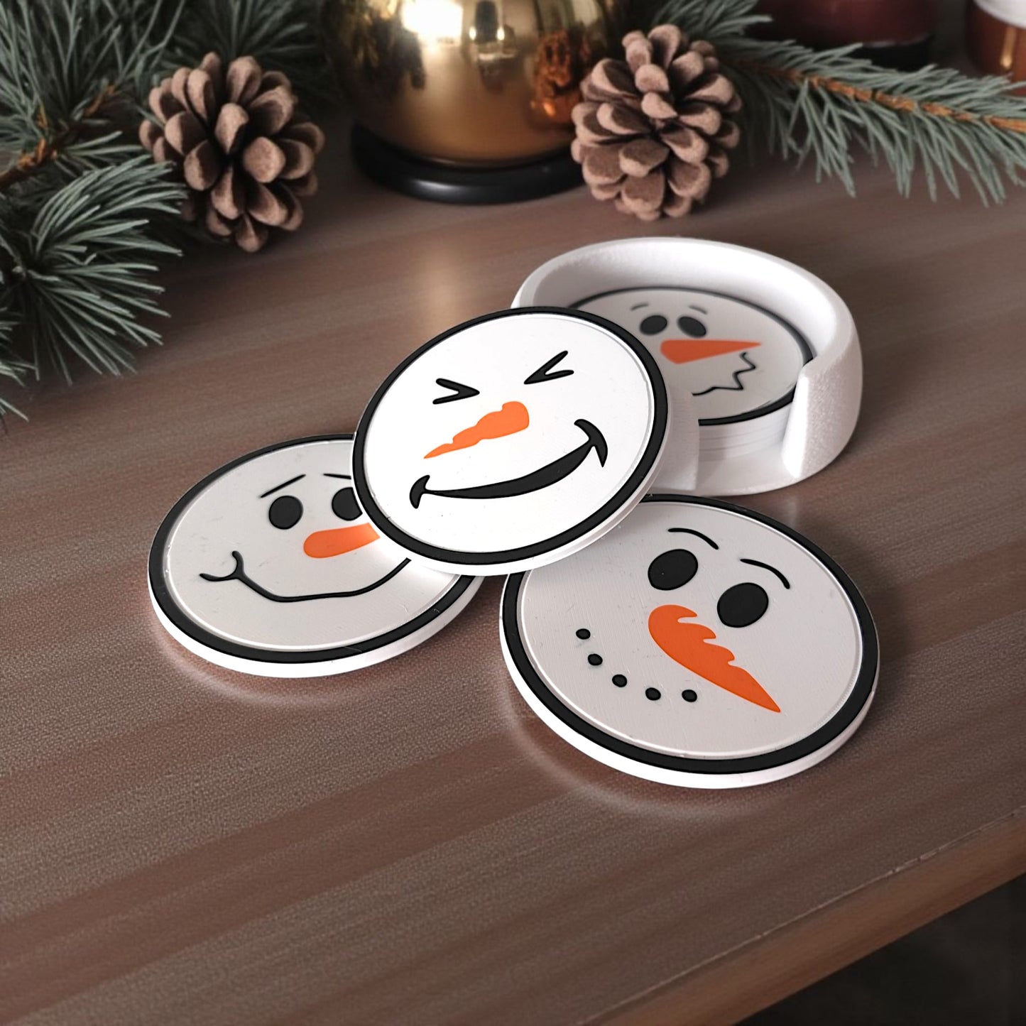 Close-up of textured snowball-like holder with snowman coasters