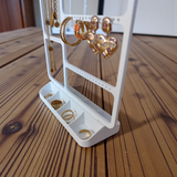 Close-up of minimalist jewelry organizer showing detailed structure for storing rings and earrings