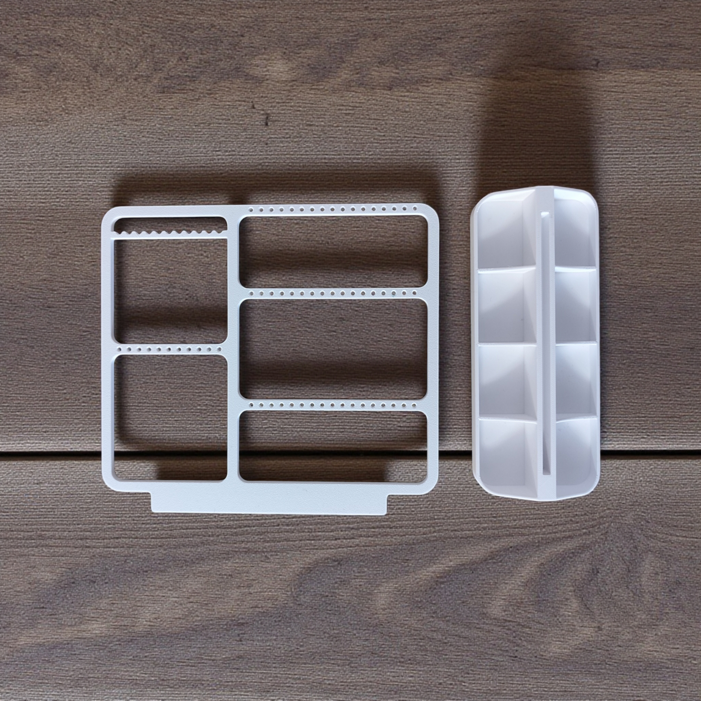 Minimalist jewelry organizer displaying earrings, rings, and necklaces in clean white design