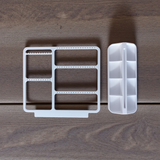 Minimalist jewelry organizer displaying earrings, rings, and necklaces in clean white design