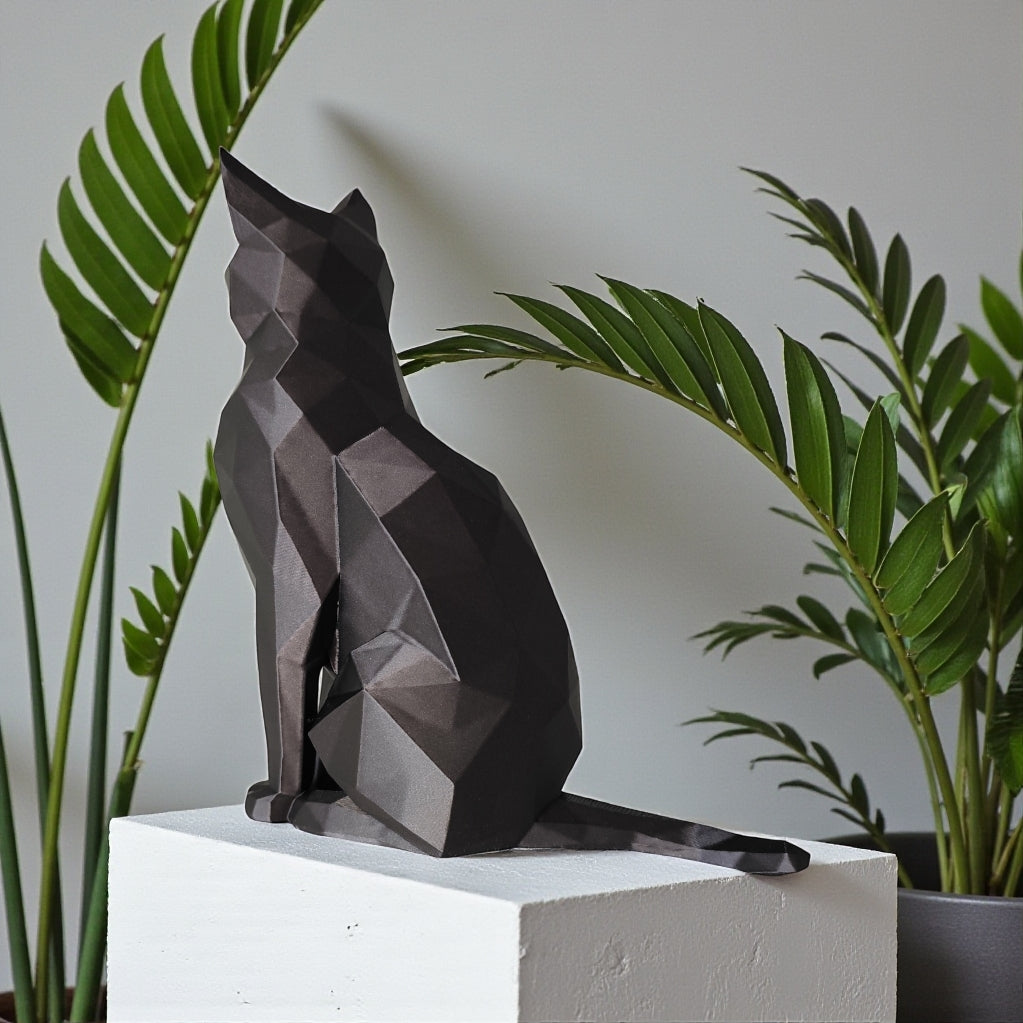 Close-up of low poly cat sculpture showing geometric facets and angles