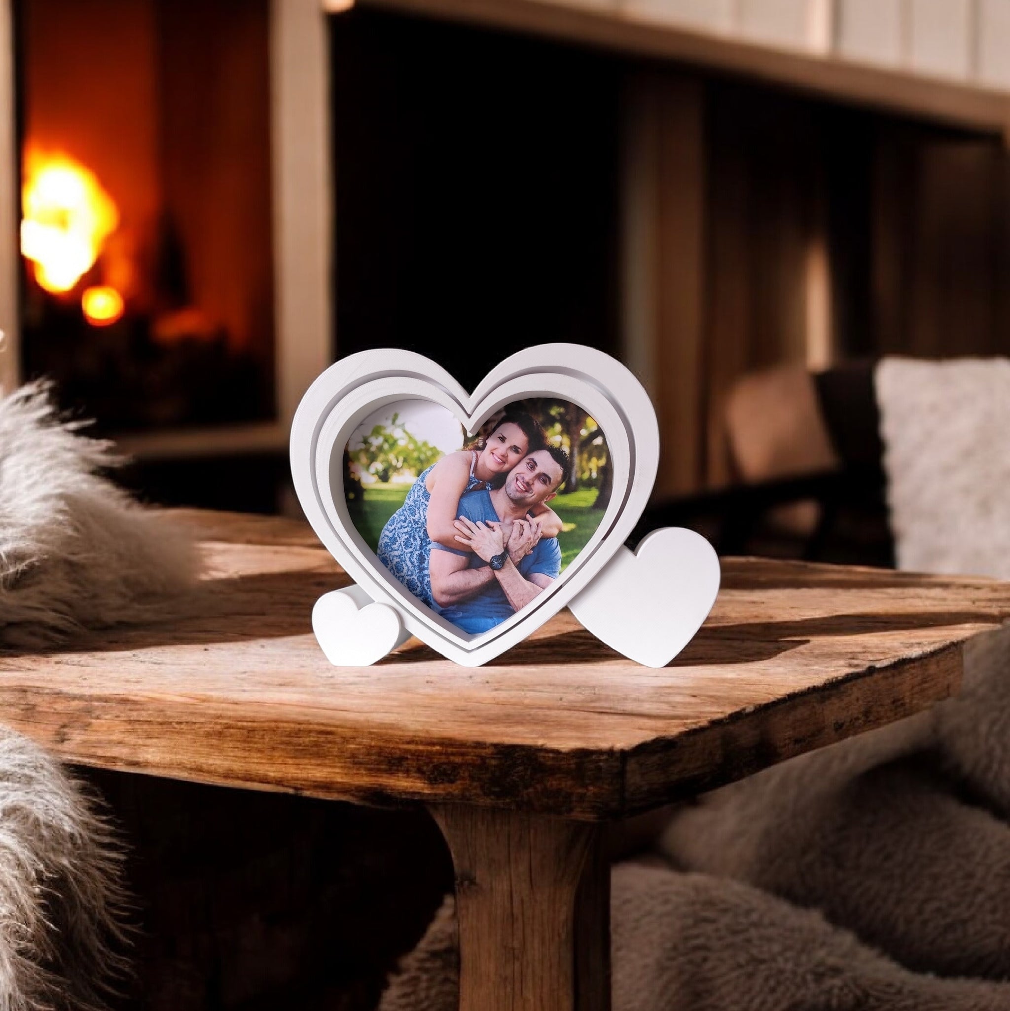 Heart-shaped picture frame displayed on wooden shelf with photograph inside
