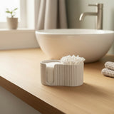 Ribbed cotton pad dispenser close-up showing textured surface detail