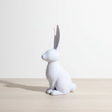 Close-up of modern ribbed Easter bunny decoration showing vertical line texture