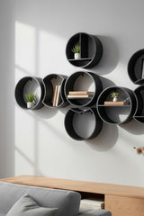 Close-up of a single round modular shelf with integrated mounting tabs
