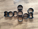 Close-up of a single round modular shelf with integrated mounting tabs