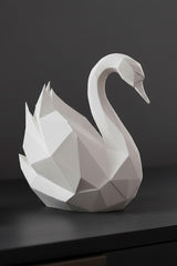 White low poly swan sculpture with angular geometric form, close-up detail